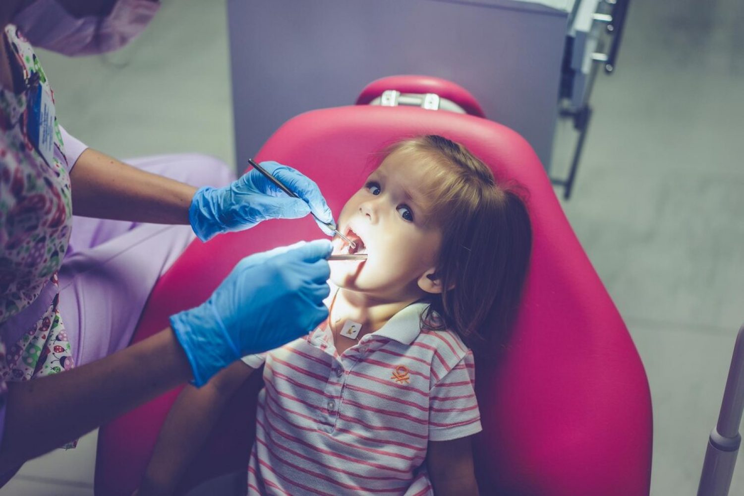 pediatric-dentist-little-girl-reception-dentist_1321-3222